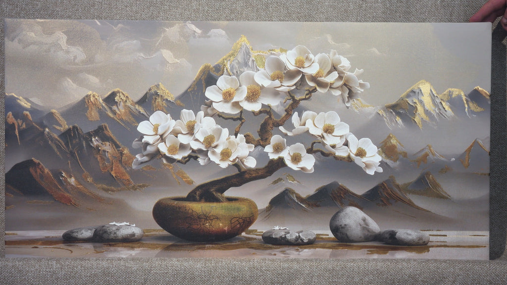 A gilded painting depicting a tree and mountains